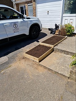 Slabs removed and Wooden flower beds installedstalled